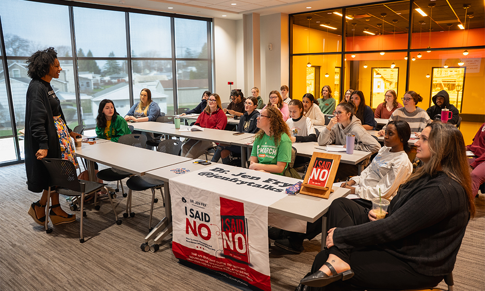 Dr. Jen Fry speaks with class