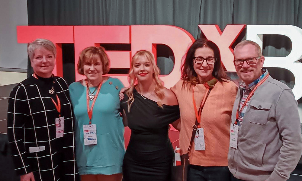 Kelsey Stanfield ’24, with Heidelberg Professors at her TEDx presentation