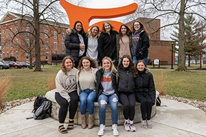 Dr. Sarah Lazzari with a group of her students