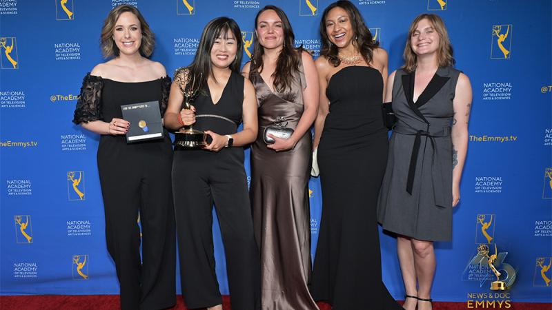 Hannah-Long Higgins and her team holding an Emmy