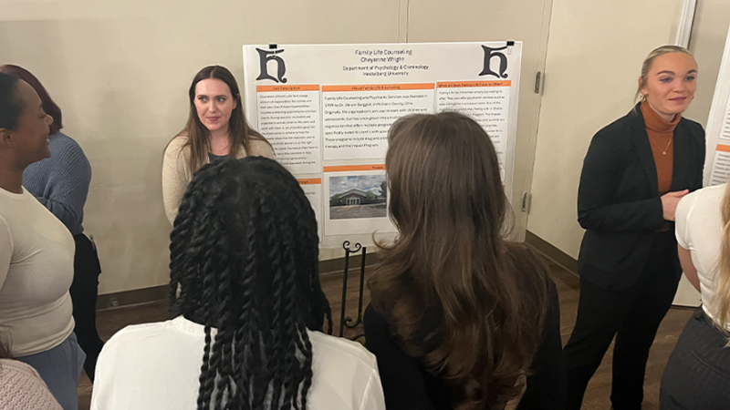 Students presenting their posters at the Behavioral Science Showcase
