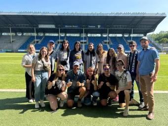 Daniel and group on a soccer field